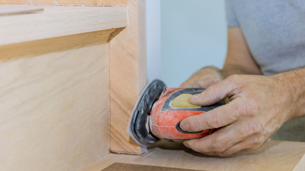 Refinishing stairwell of railing framing trim with carpeted grinding polishing