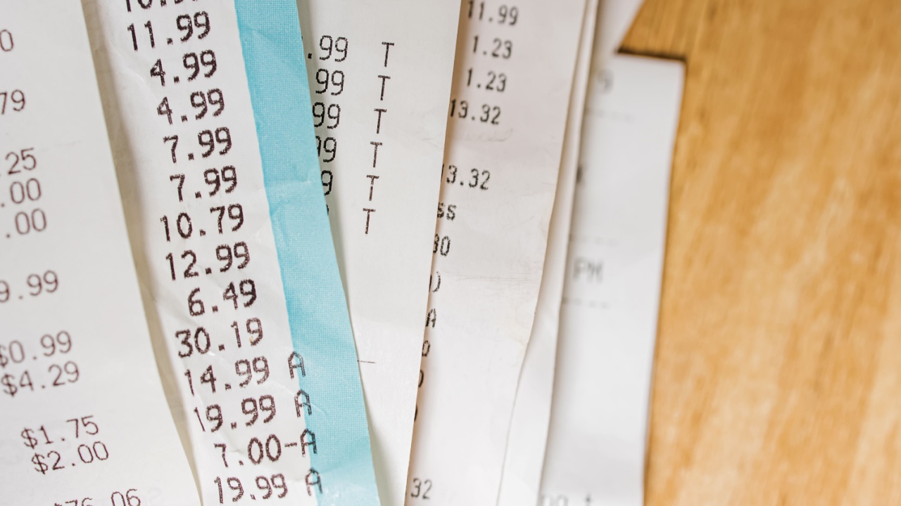 Close-up of receipts from different stores. Accounting, taxes, cost of living