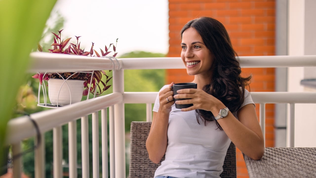 beautiful young woman relaxing over a cup of tea
