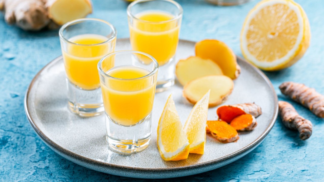 Boosting immune system - homemade healthy Ginger Lemon Turmeric Shot with ingredients