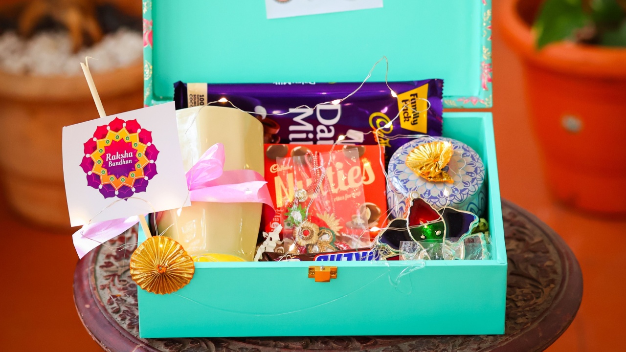 Bangalore, India 10th August 2023: Beautiful Rakhsa Bandhan customised gift hamper for the festive season. Assorted box consisting of Chocolates and snacks like Cadbury, kitkat, Kurkure and Dairy Miik