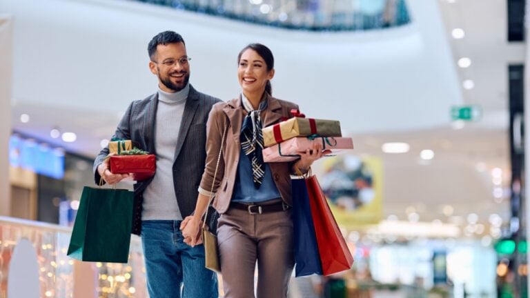 Carefree couple having fun during their shopping day at the mall