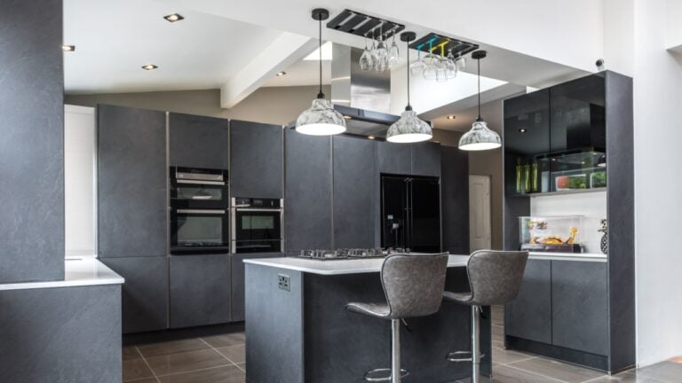Beautiful grey slate and marble European style modern home kitchen. Elegant minimal home interior style decor. Luxury living standards at home.