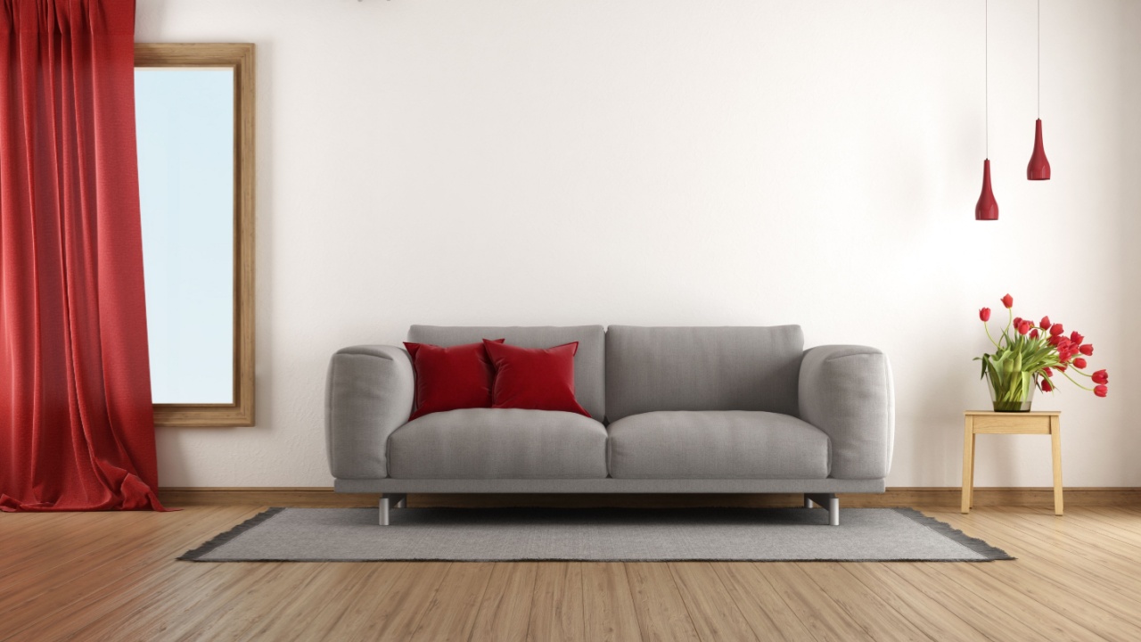 Cozy and stylish living room with gray sofa, red accents, and hardwood floor- 3d rendering