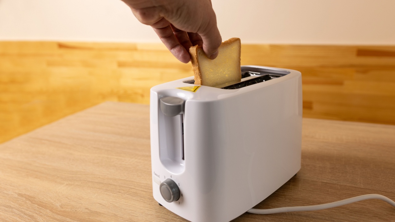 To make toast, bread is loaded into an electric