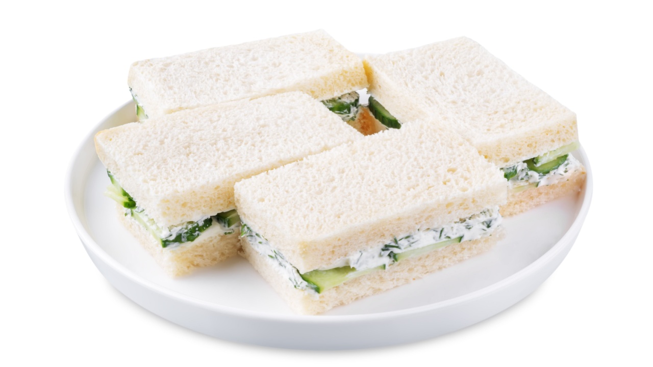 Cucumber dill cream cheese tea sandwich on a white isolated background. toning