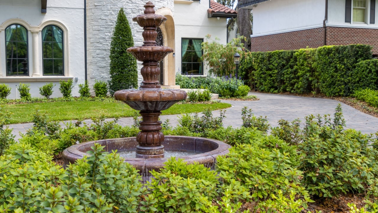 Fountain in front of fancy home