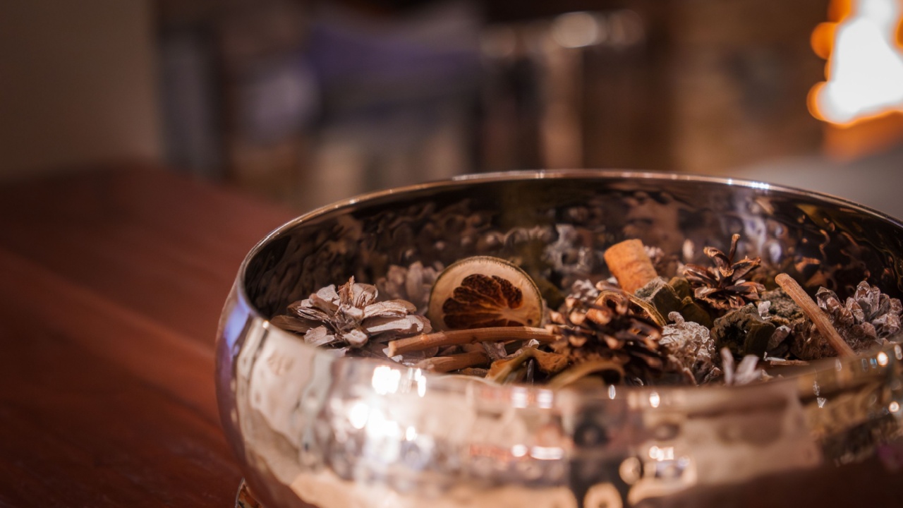 Close up view of decorative bowl with dried natural items like citrus slices, cinnamon sticks, and pine cones. Possibly in luxury Zermatt ski resort in Switzerland.