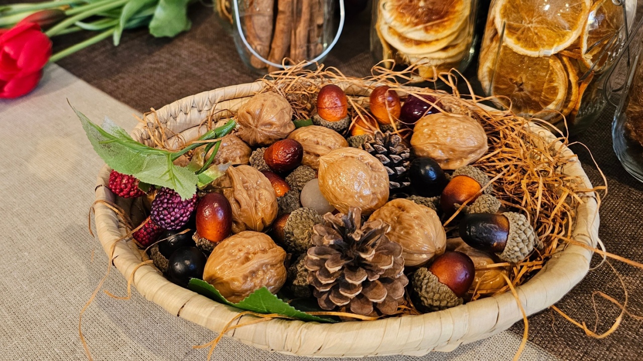Basket accessories with walnuts, acorns, pine cones, etc. and interior decoration with tulip flowers