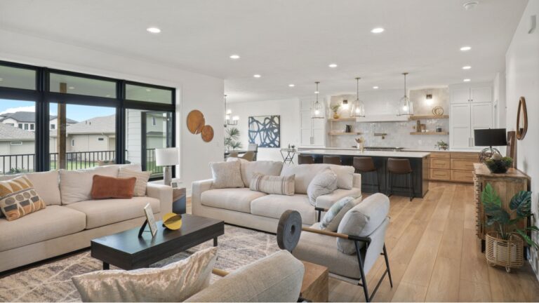 OMAHA, NE USA - 06-29-24 - Luxury open concept living room and kitchen with high end interior design features and transitional modern decor