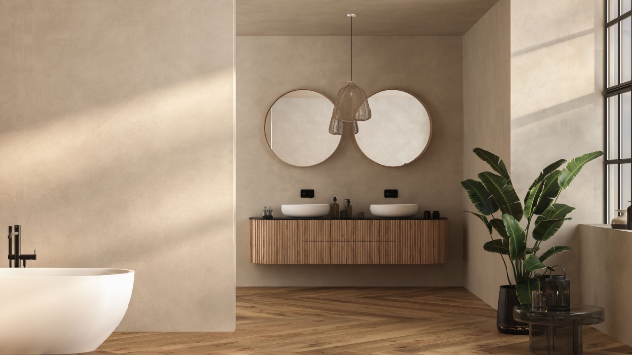 Beige bathroom interior with double sink and mirror, carpet on hardwood floor, bathtub, plants. Bathing accessories and window in hotel studio