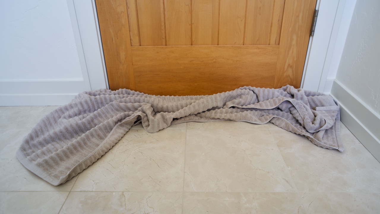 Bottom of house door blocked with towel