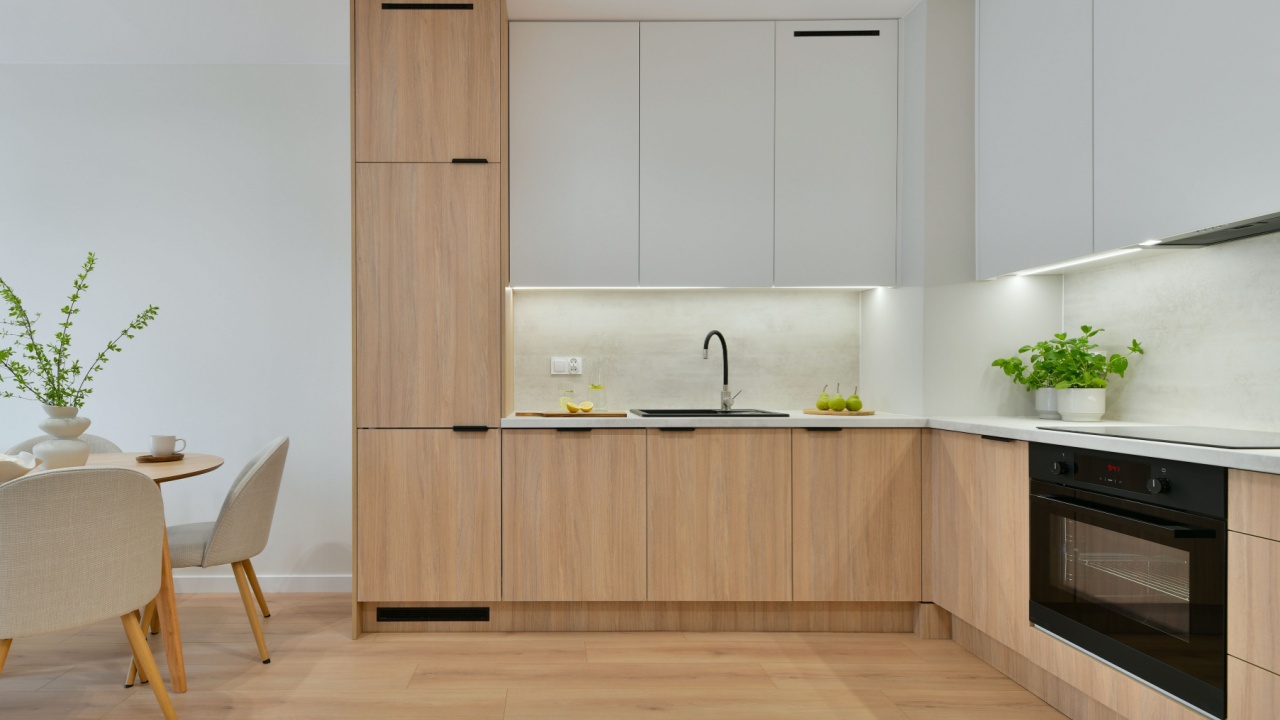 Photo of Modern Scandinavian Japandi Kitchen Interior with Built-In Appliances, Wooden Cabinets and Dining Area