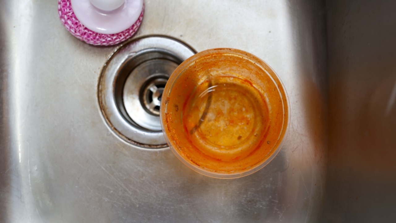 An old stained plastic food storage container