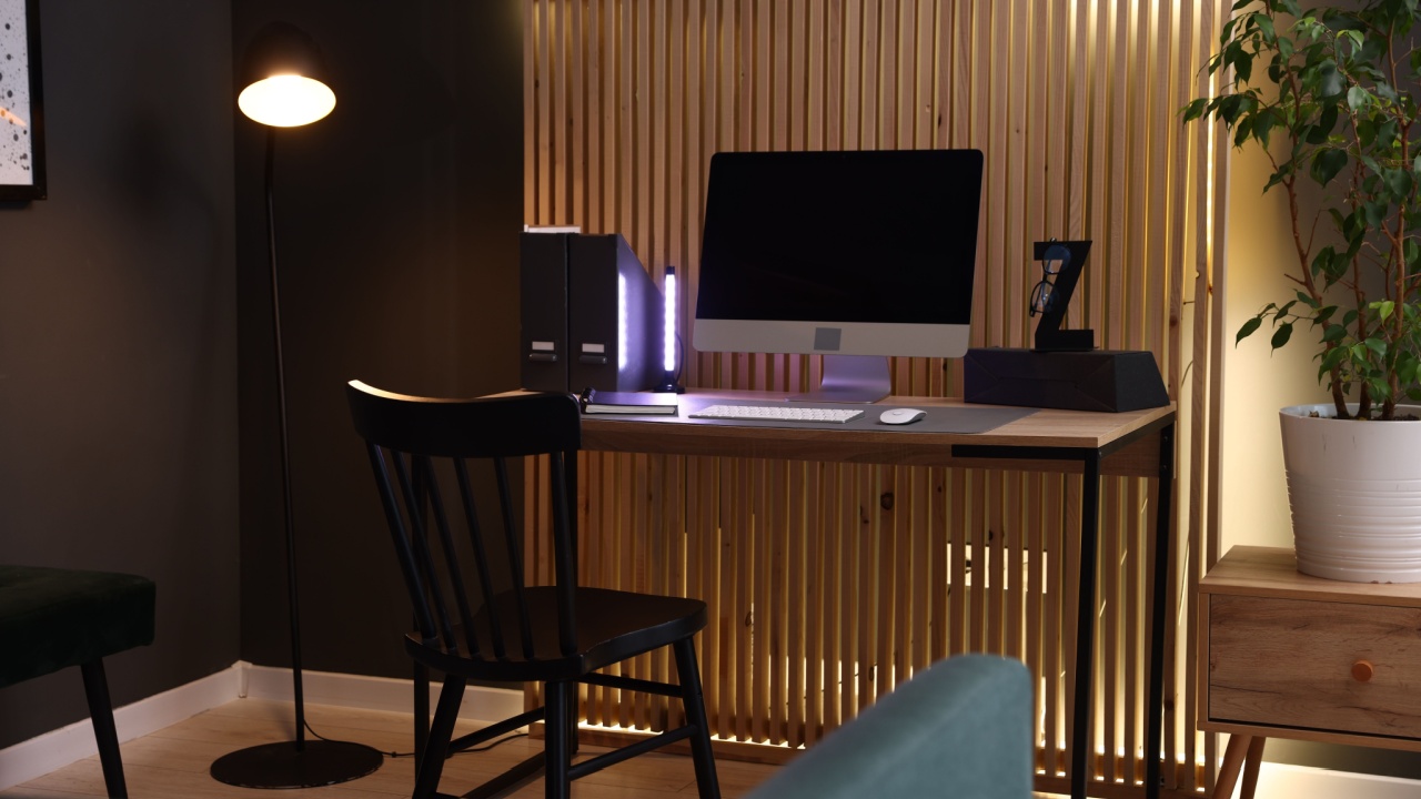 Stylish workplace with wooden desk, computer and chair indoors