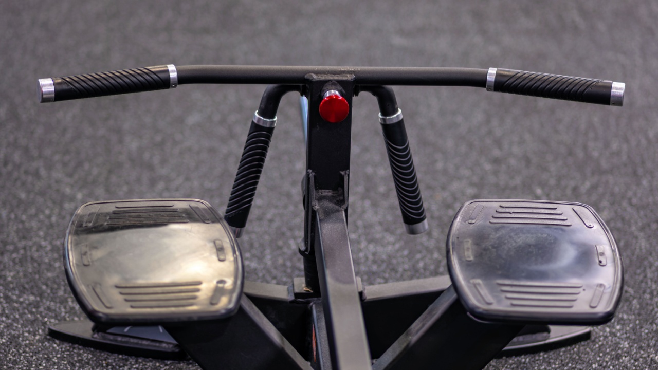 A close up of a stationary exercise bike on a gym floor