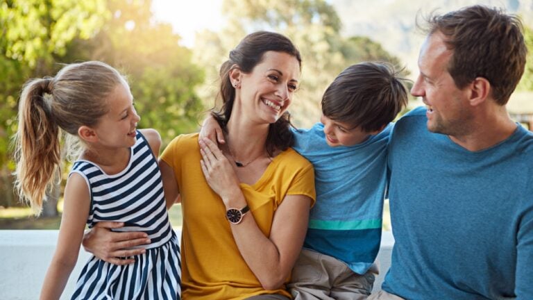 Love, parents and children in backyard with laugh, connection or bonding on summer break. Happy, family or people outdoor with trust, healthy relationship or emotional development on spring vacation.