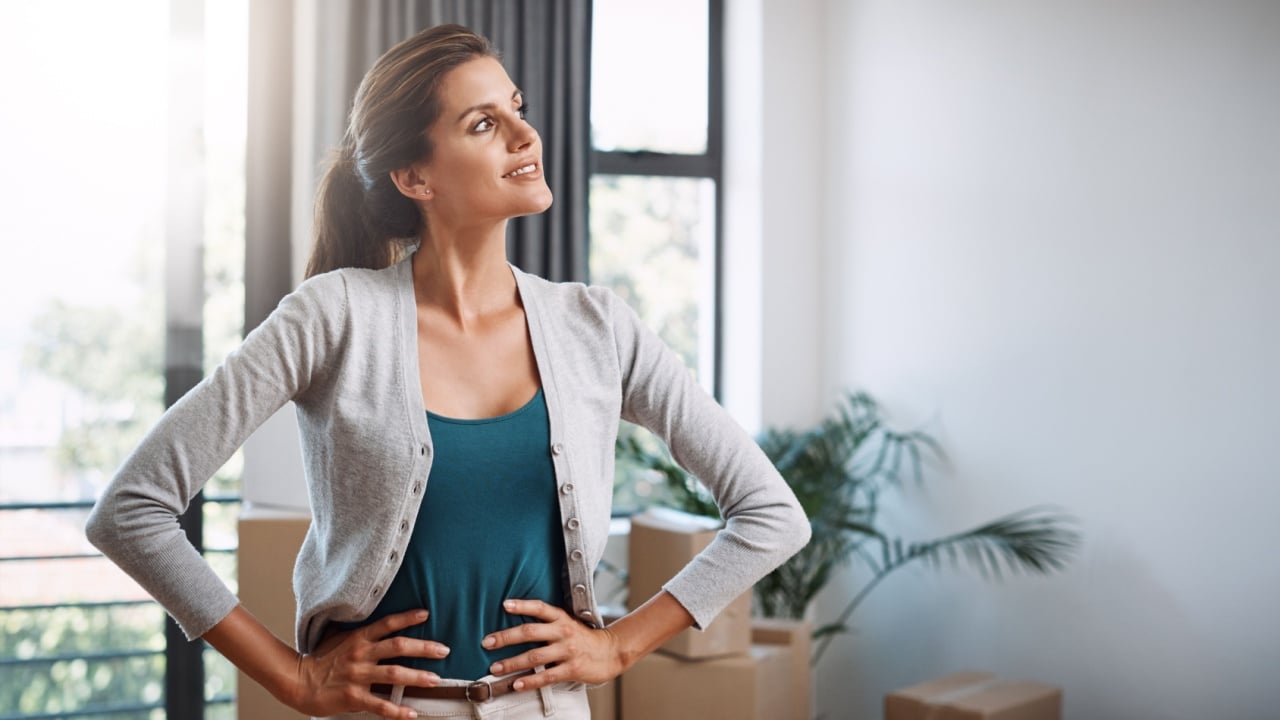 Thinking, new home and woman with planning for decoration, furniture and interior design for moving. Real estate, happy and person with boxes and reflection, thoughtful and idea for house renovation