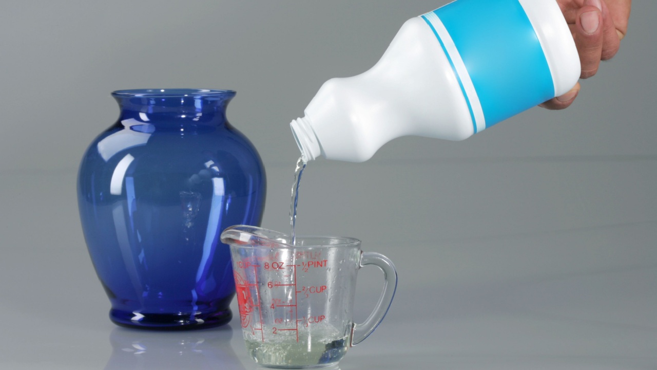 Pouring Bleach on Measuring Cup