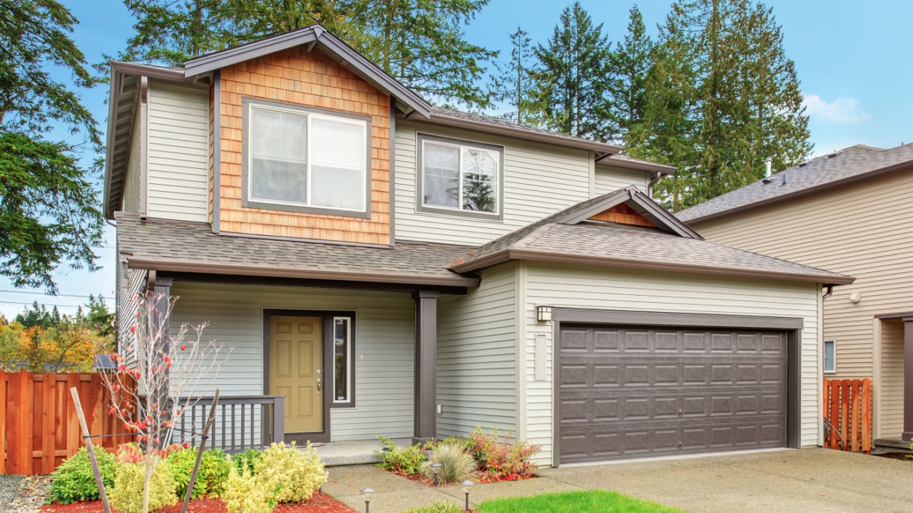 Large house with driveway and garage.