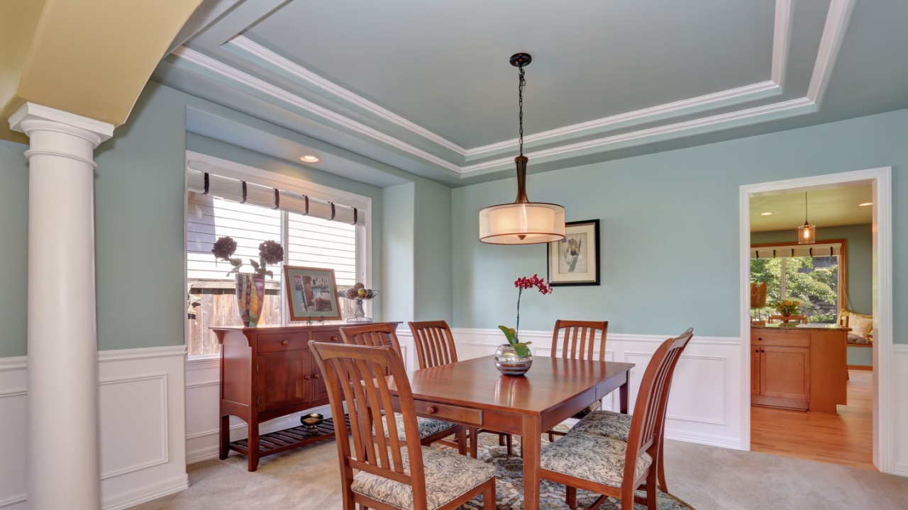 Dining room interior with mint walls and coffered ceiling. Northwest, USA