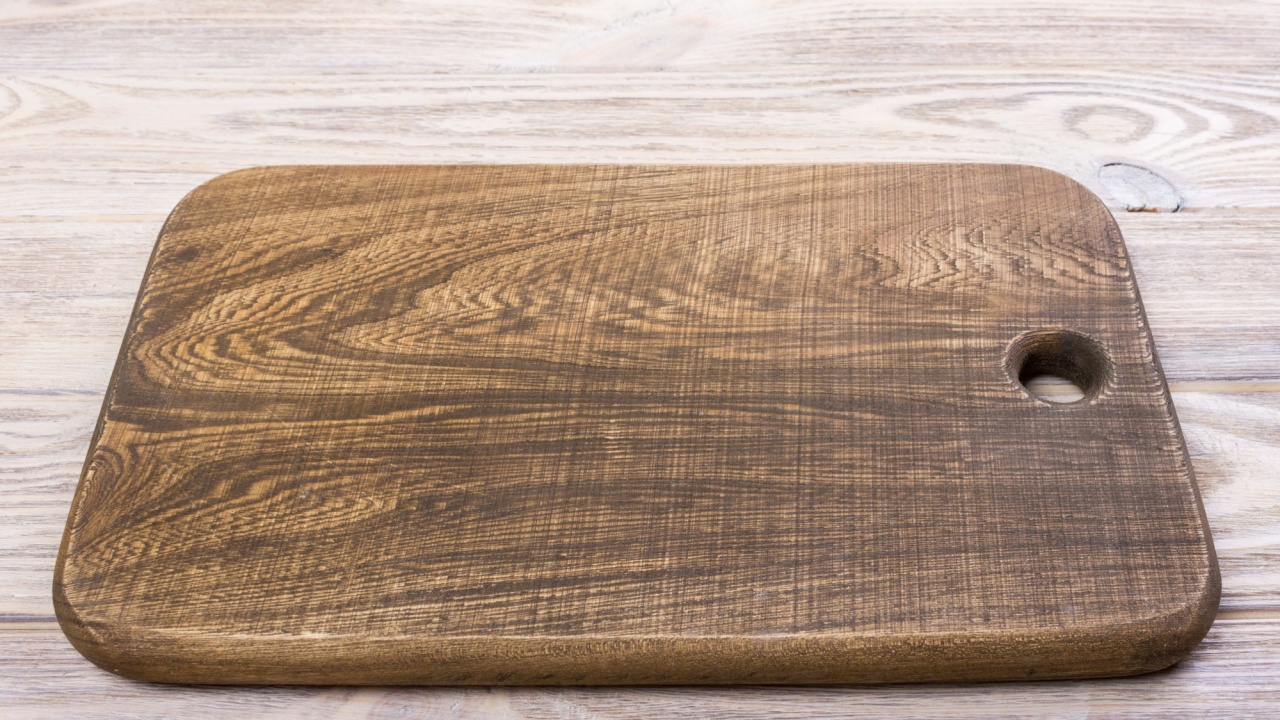 top view of wooden cutting board on old wooden table