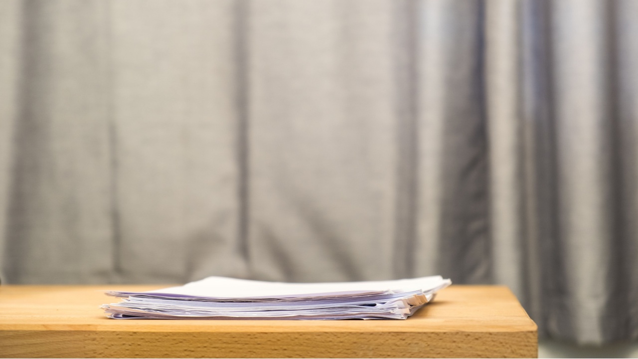 Document on wood table.