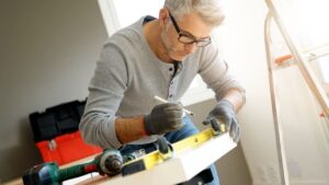Man at home assembling DIY furniture