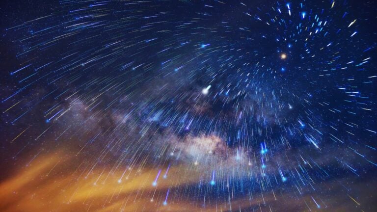 a meteor shower in the night sky