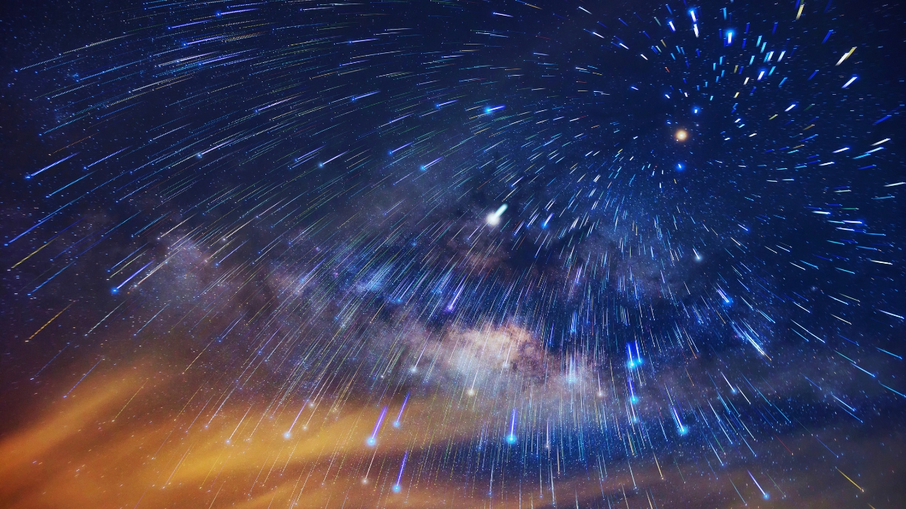 a meteor shower in the night sky