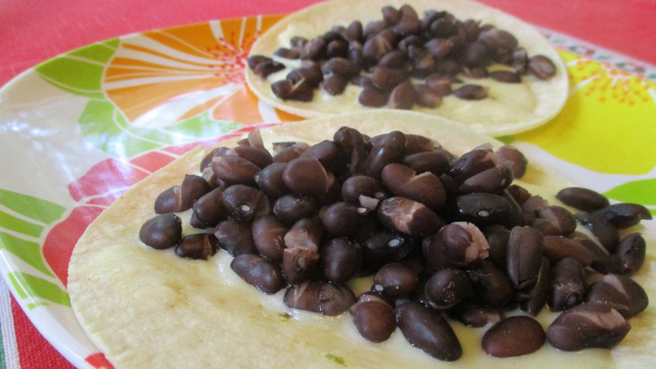 From dried black beans, commercially prepared tortillas, cheese.