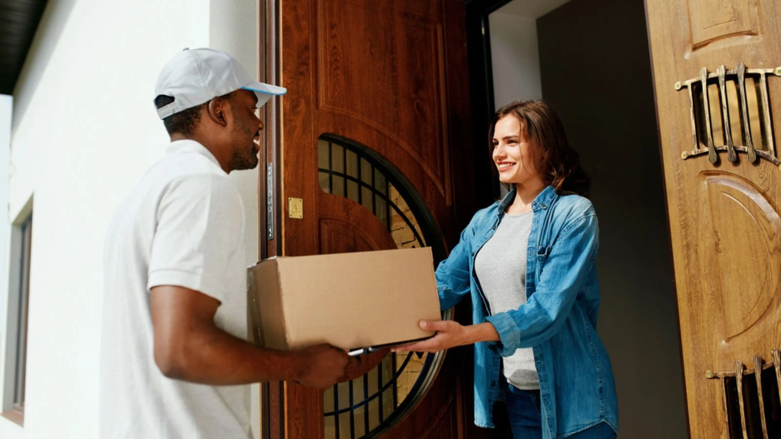 Home Delivery. Courier Delivering Package To Client