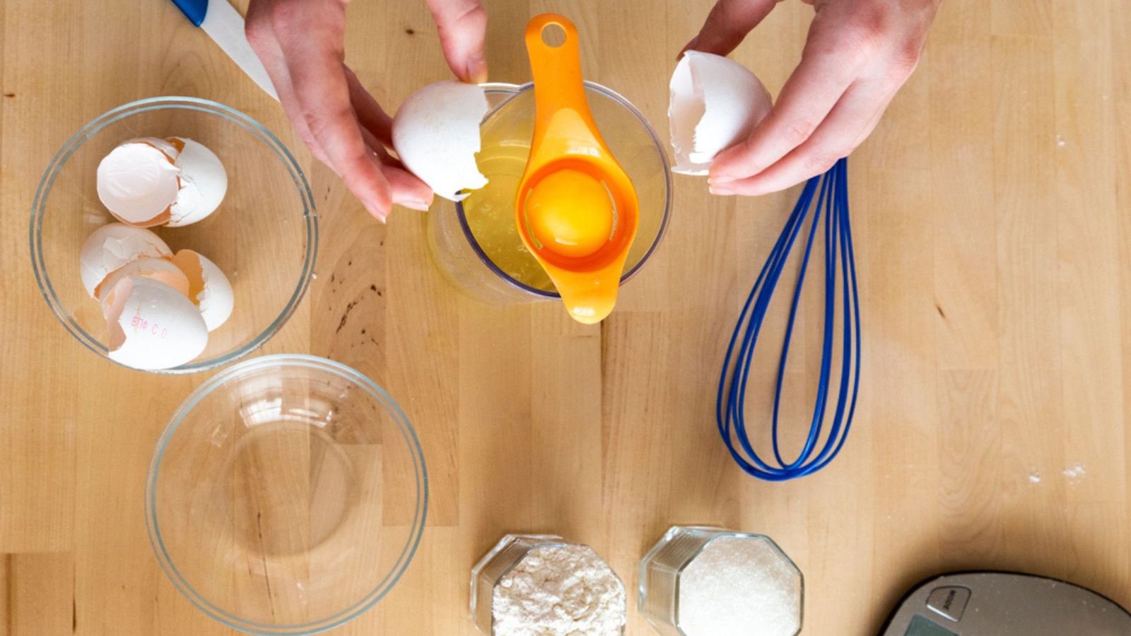 Separating yellow yolks from protein in raw eggs for cake, biscuit and cream. Step 4 Put egg in separator