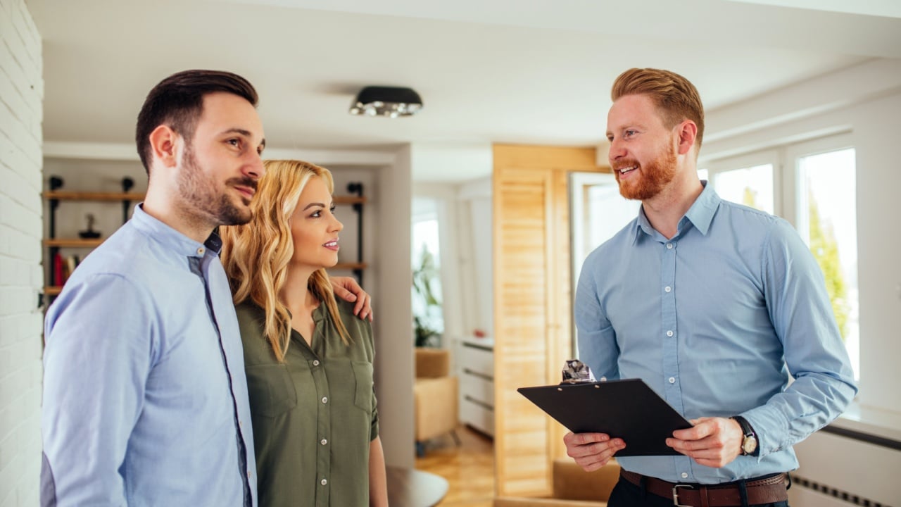 Couple having meeting with real estate agent