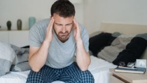 Man with sleeping problem wake up feeling tiredness