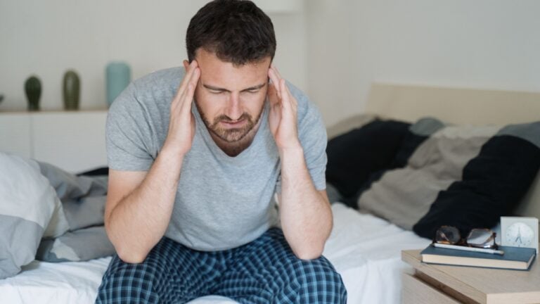 Man with sleeping problem wake up feeling tiredness