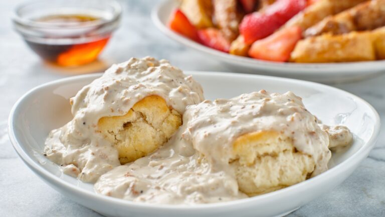 biscuits and gravy with sausage on plate