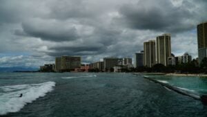 Waikiki, Honolulu, Hawaii, USA. October &lrm;11, &lrm;2019. Storm clouds over a city on a Hawaiian city in the Pacific Ocean.