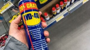 BELGRADE, SERBIA - MARCH 21 2021: WD 40 logo on some of their water displacer sprays for sale in Belgrade. WD-40 is an iconic American brand of chemicals used to unstuck and loosen