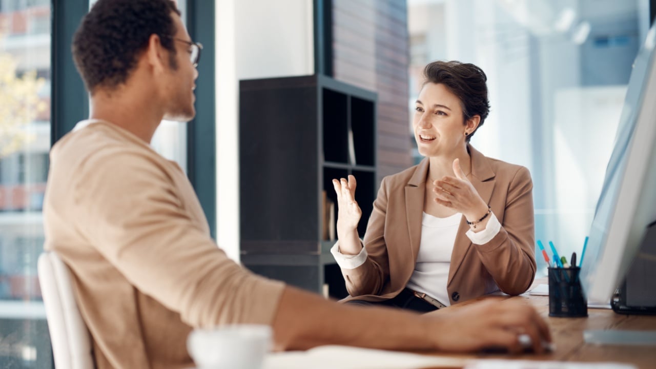 Getting her point across. Shot of two businesspeople having a discussion in an office.