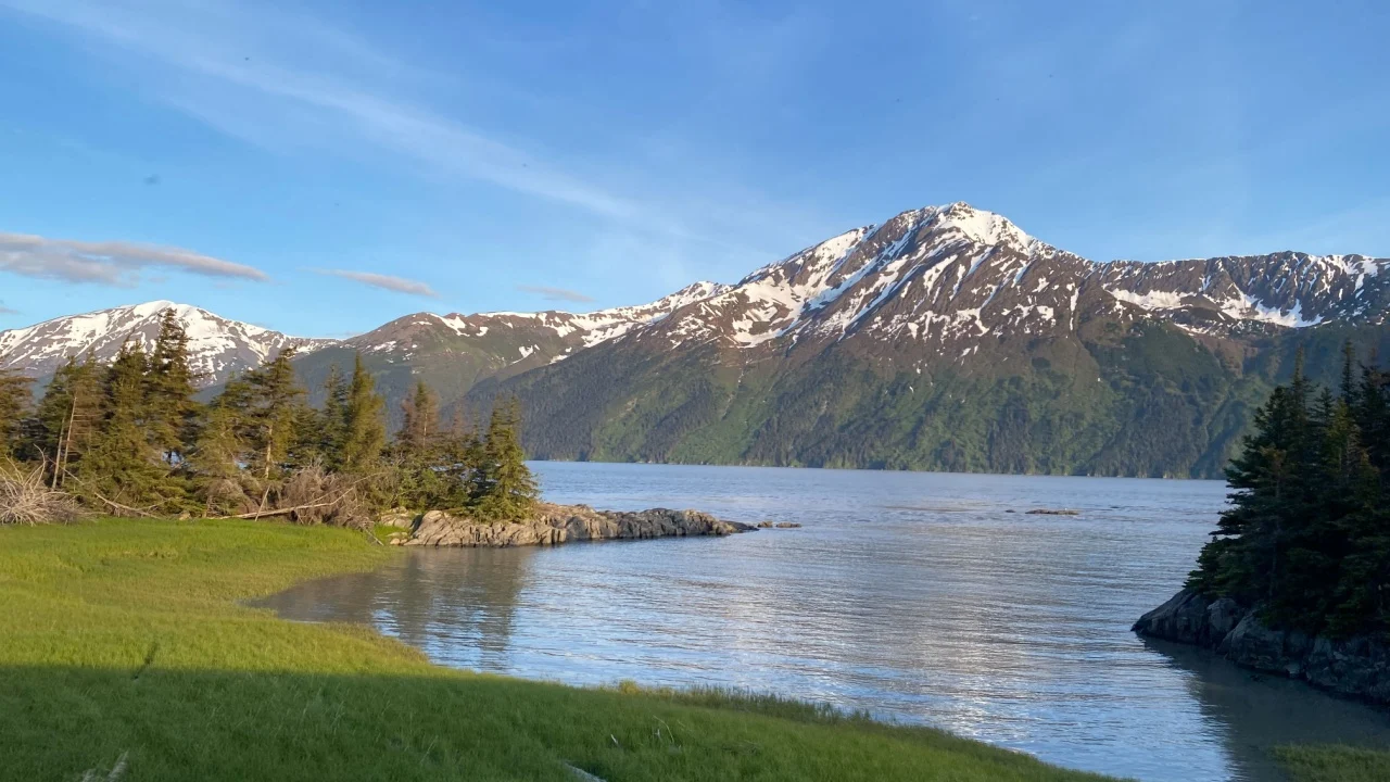 Kenai Lake (Dena'ina: Sqilan Bena) is a large, zig-zag shaped lake on the Kenai Peninsula, Alaska. The lake forms the headwaters of the Kenai River.