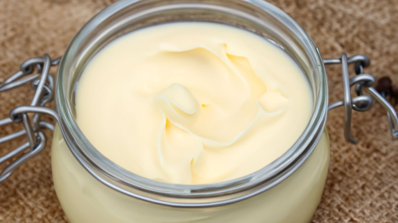 Creamy Homemade beef tallow glass , close-up