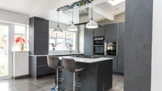 Beautiful grey slate and marble European style modern home kitchen. Elegant minimal home interior style decor. Luxury living standards at home.