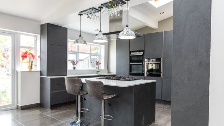Beautiful grey slate and marble European style modern home kitchen. Elegant minimal home interior style decor. Luxury living standards at home.