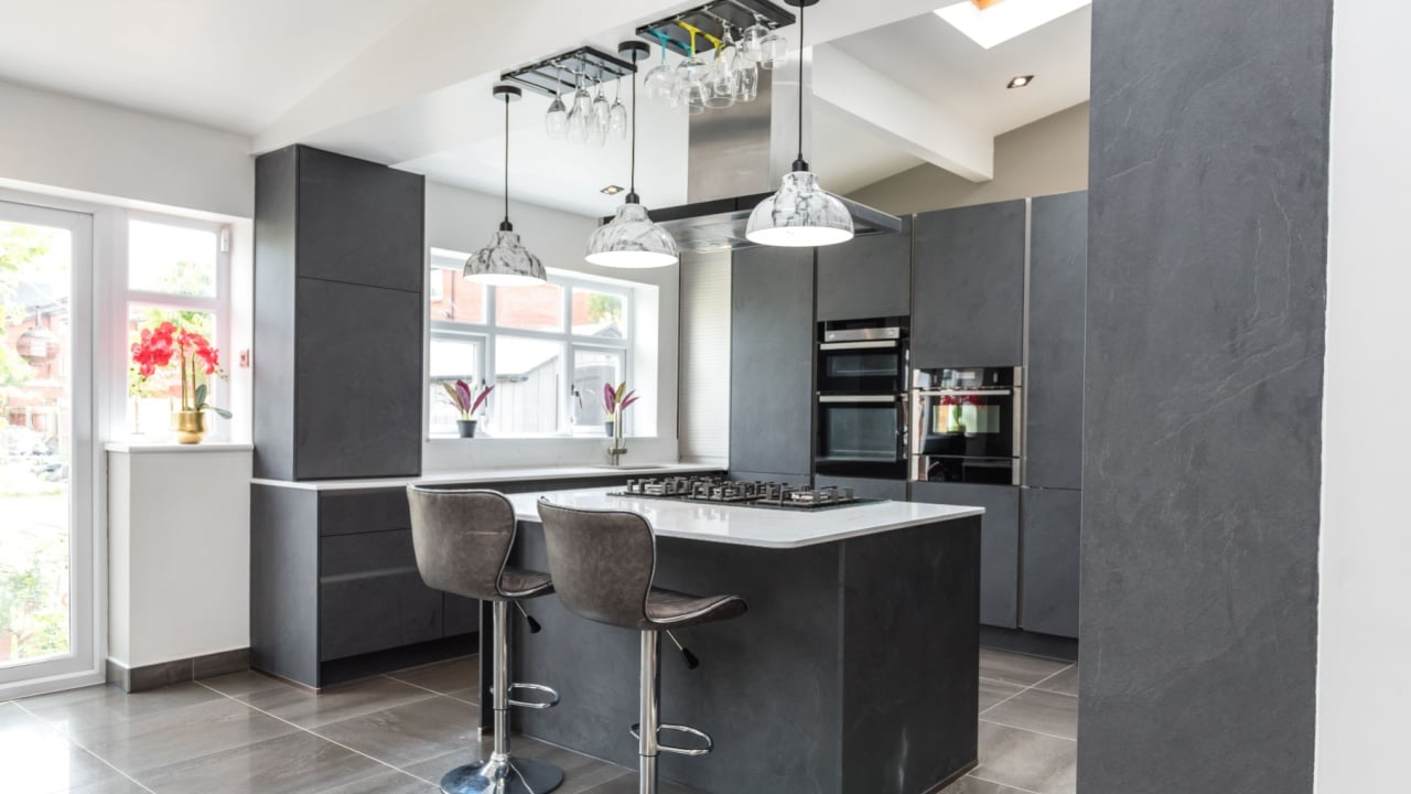 Beautiful grey slate and marble European style modern home kitchen. Elegant minimal home interior style decor. Luxury living standards at home.