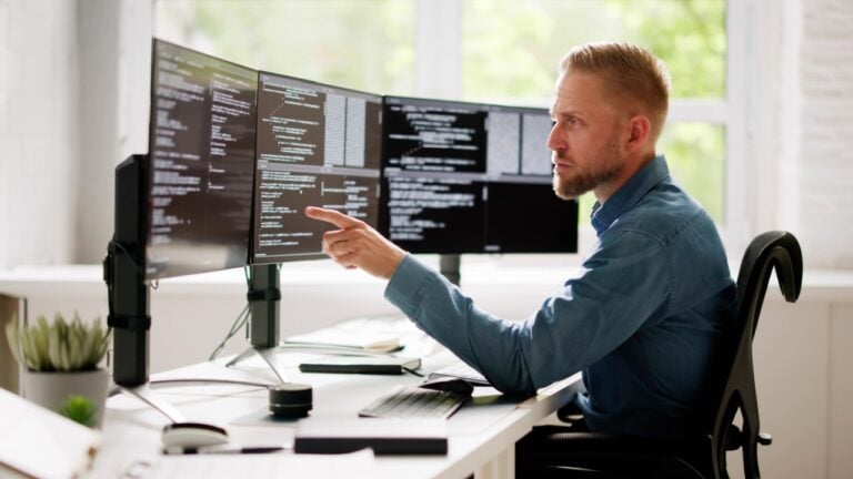 Web Developer Coding On Computer To Develop Code