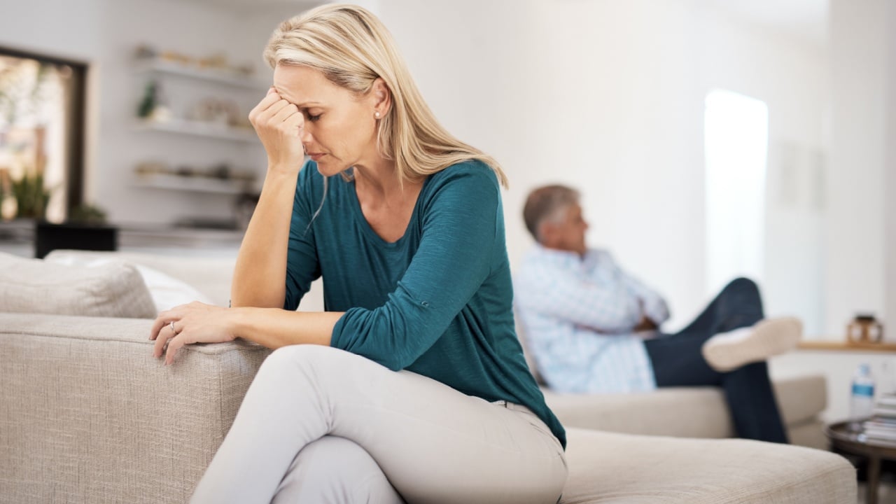 Couch, couple and fight in home for annoyed, divorce or married people for argument. Disagreement, sofa and lounge for frustrated woman, affair or emotion in toxic relationship with mature partner