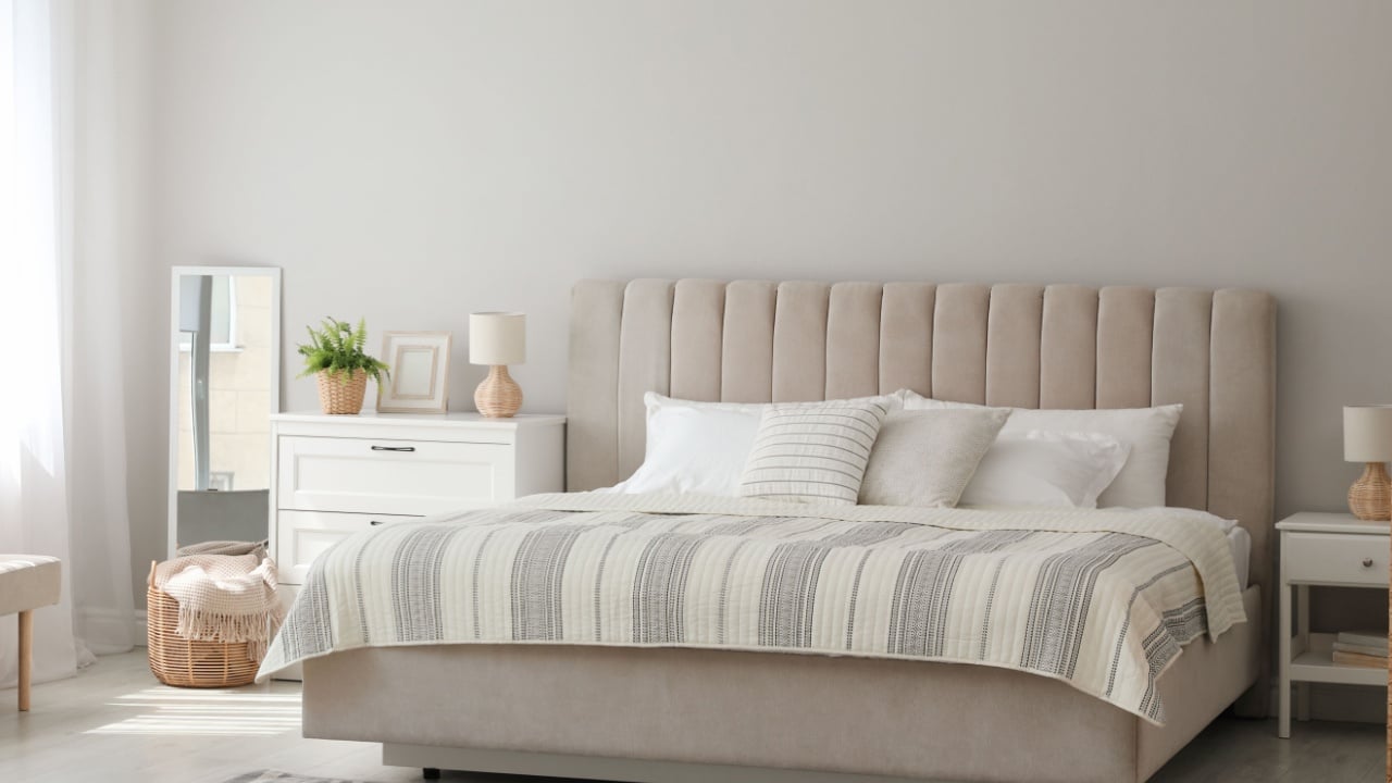 Stylish interior of contemporary bedroom with comfortable bed