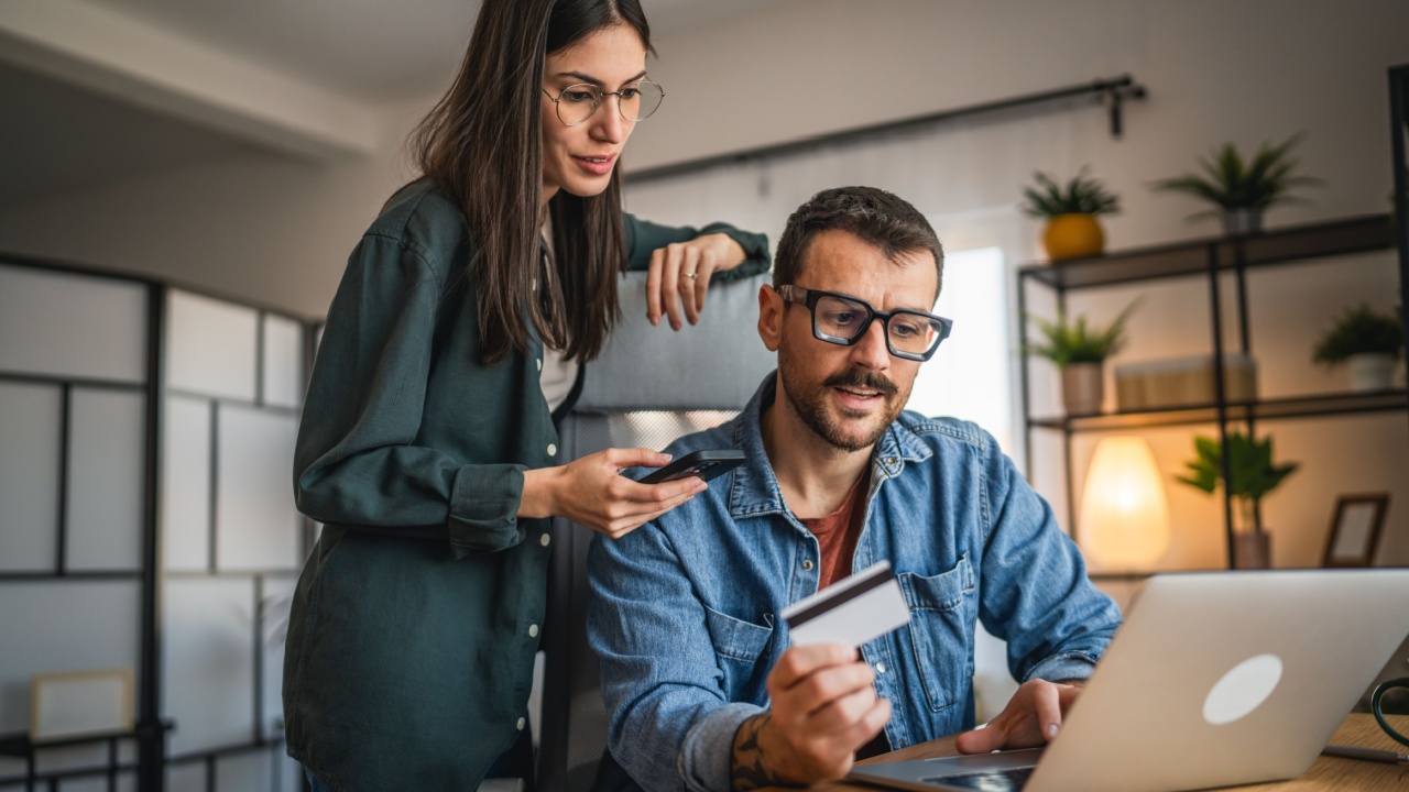 man and woman couple work from home and buy online on laptop and credit card