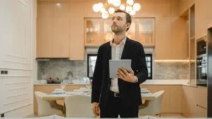 Man buyer examination home structure systems and components qualified interior and exterior features before transaction.